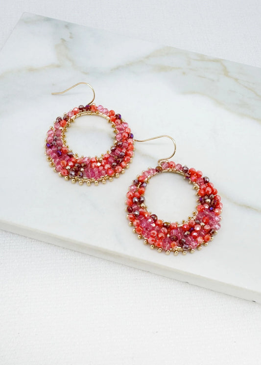 Round pink and orange faceted bead earring