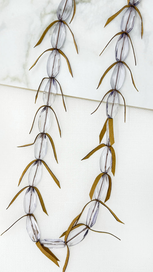 Long beige frosted bead with feathered design