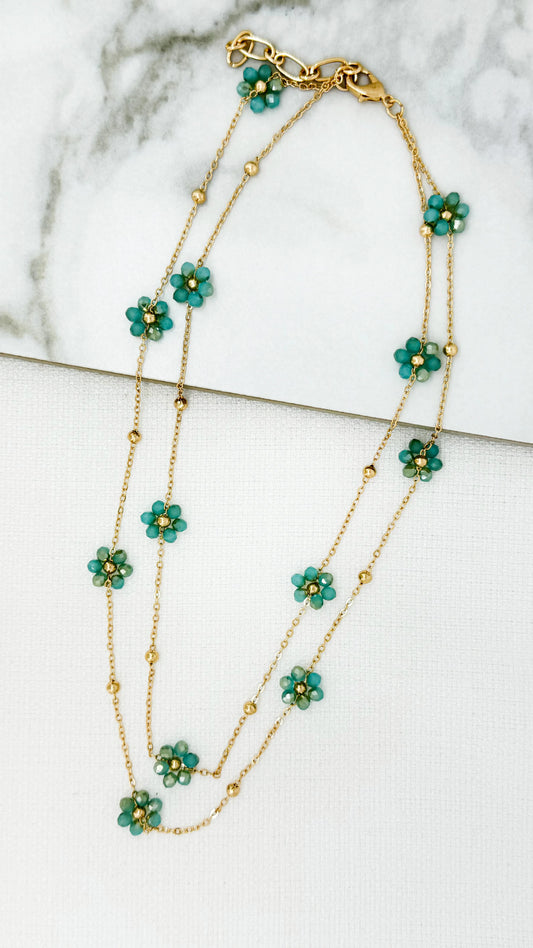Short gold double layered necklace with turquoise crystal daisy design