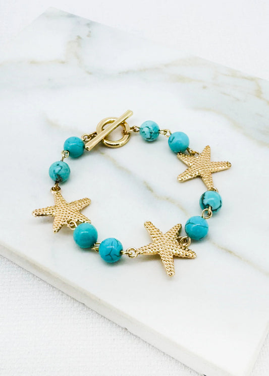Turquoise bead and gold T-bar bracelet with starfish design