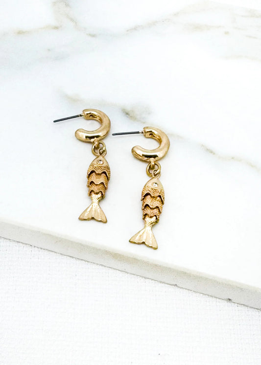 Gold hoop earring with fish dropper
