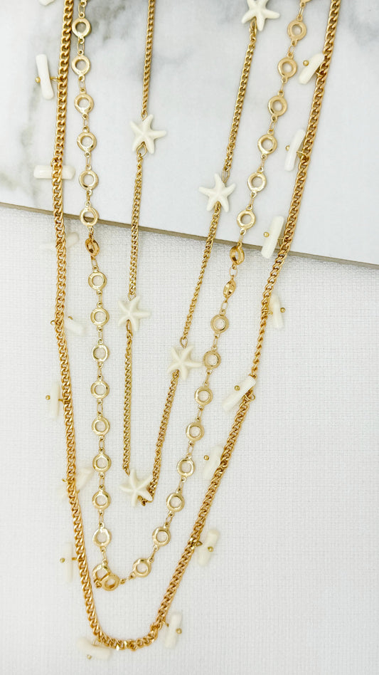 Long gold triple layer chain necklace with cream