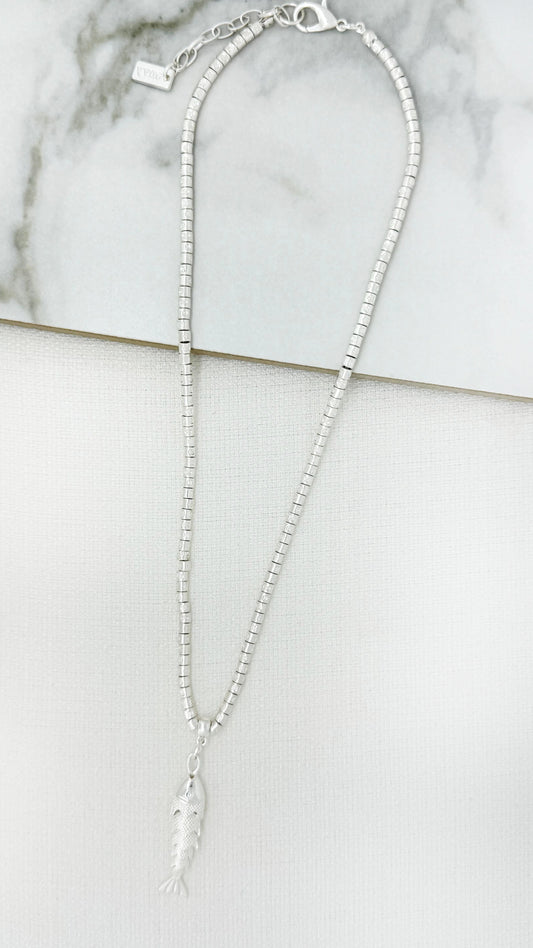 Short worn silver necklace with fish pendant