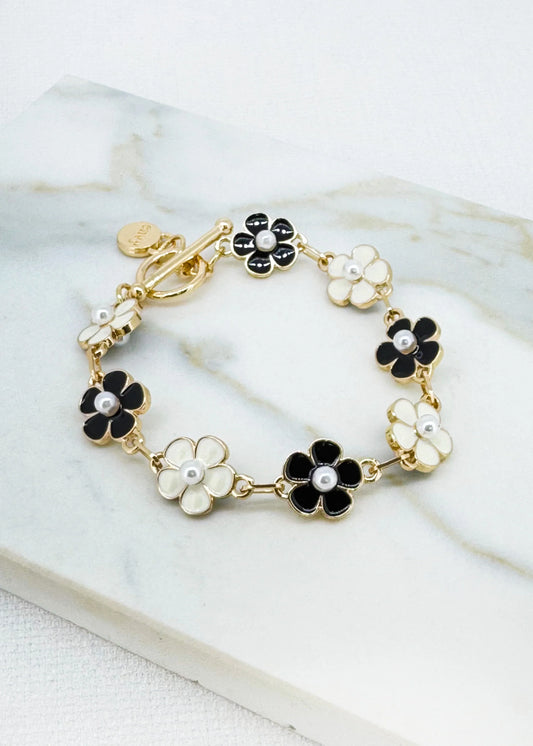 Gold bracelet with black and white daisies